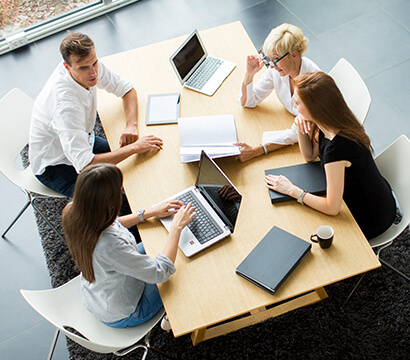IT team members collaborating on a custom software project in a meeting